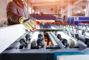 Window pane coming off conveyor belt for glass manufacturing