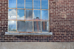 Discolored old glass on an industrial building