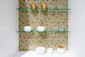 clear glass shelves on a tile wall