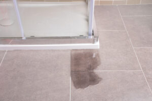 glass shower foundation leak onto tile floors